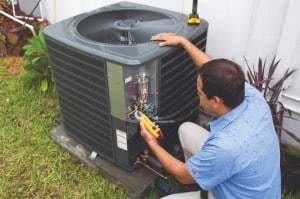 A technician offering AC repairs at a home in Gladstone, MO