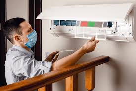 man works with mask on