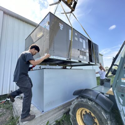 man try to adjust heavy equipment